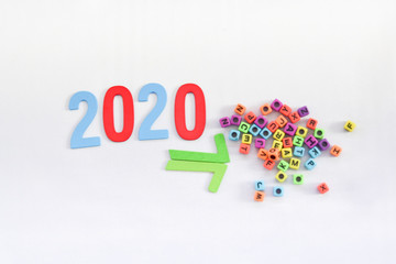 Block of 2020 wording and english word toys for new year isolated on white background. 2020 Happy New Year.