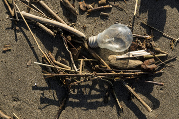 Litter and Plastics washed up on the beach and remnant of floods in Spain