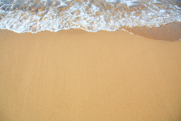 Bright sandy beach coastline.