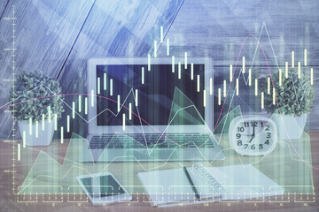 Double exposure of forex graph and work space with computer. Concept of international online trading.