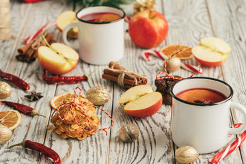 Oatmeal cookies on a old wooden background with cinnamon sticks and decorations