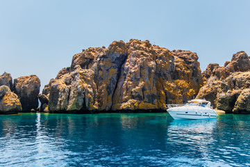 Luxury yachts at anchor coast Rocks