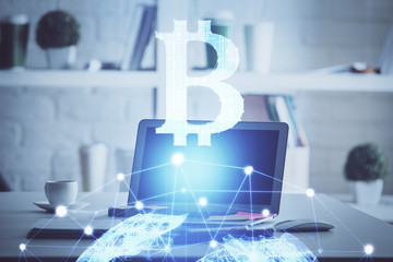 Multi exposure of blockchain theme hologram and table with computer background. Concept of bitcoin crypto currency.