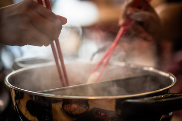 Shabu-shabu is a Japanese nabemono hotpot dish of thinly sliced meat and vegetables boiled in water. The term is onomatopoeic, derived from the sound emitted when the ingredients are stirred 