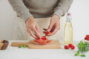 Fresh delicious salad with tomatoes. Doing fresh green salad