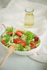 Healthy food and diet menu. Various fresh mix salad with tomato, cucumber, onion