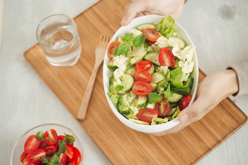 Vegetable mix salad in a bowl on kitchen table