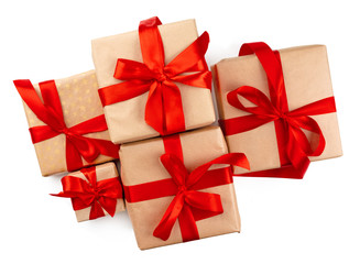 Craft christmas gifts with red bows isolated on white background, top view