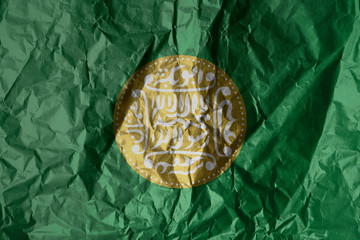 Rohingya flag painted on crumpled paper background