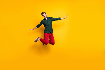 Naklejka na ściany i meble Full length body size photo of cheerful trendy man pretending to be air plane white smiling toothily beaming isolated vivid color background with hands spread