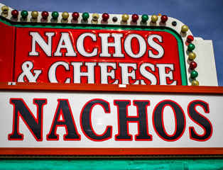 Fototapeta premium Carnival Food. Vintage sign advertising nachos and cheese.