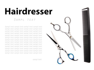 Scissors and comb on a white background