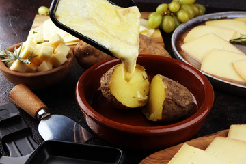 raclette cheese melted served in individual raclette skillets