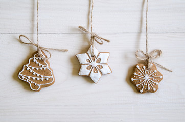 Christmas gingerbread of different kinds on a black and white wooden background