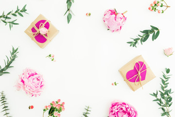 Frame of peonies, roses flowers and eucalyptus with gifts on white background. Valentines day. Flat lay