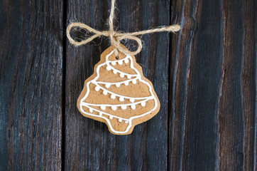 Christmas gingerbread of different kinds on a black and white wooden background