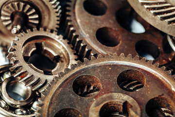 Close up of old rusty car parts on dark background