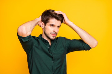 Turned photo of worried troubled man having problem of hair loss looking down disappointed with...