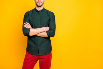 Real executive concept cropped photo of serious confident cool entrepreneur guy cross hands look wear modern outfit red pants trousers isolated over yellow color background