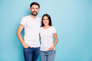 Naklejka premium Portrait of lovely enthusiastic man and woman have fun hug wear good look white outfit isolated over blue color background