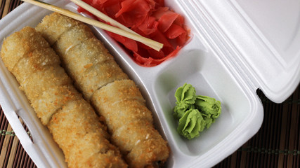Salmon sushi rolls, a set japanese food top view, wasabi