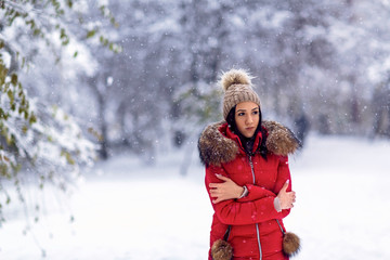 Fototapeta na wymiar Girl enjoying in the snow.Happy girl standing outdoors in snow during winter.