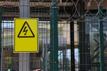 Yellow-black danger symbols about electrical hazard