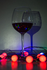 glass of red wine on wooden table