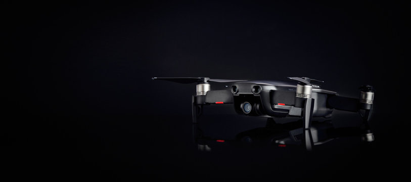 DJI MAVIC AIR on black background. Popular compact quadcopter 