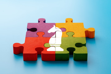 Business & strategy icon on colorful jigsaw puzzle