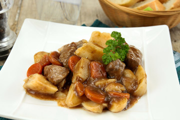 plate of beef bourguignon and potato