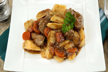 plate of beef bourguignon and potato