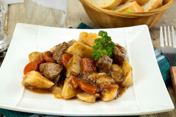 plate of beef bourguignon and potato