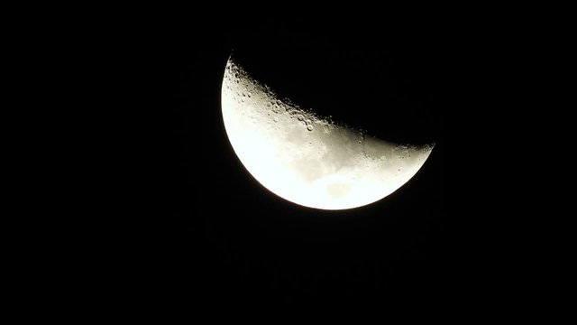 Silver half moon in dark sky of Sao Paulo city, Brazil