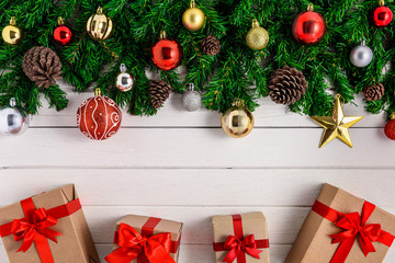 Fototapeta na wymiar Christmas fir tree with decoration on white wooden board