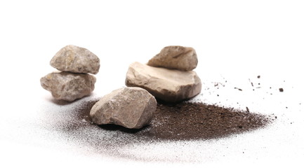 Decorative rocks in pile of soil, dirt isolated on white background