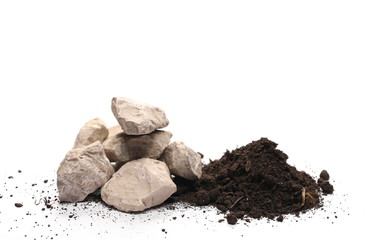 Decorative rocks in pile of soil, dirt isolated on white background