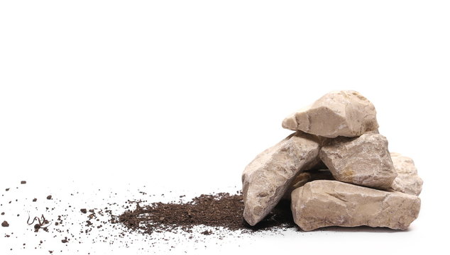 Decorative rocks in pile of soil, dirt isolated on white background