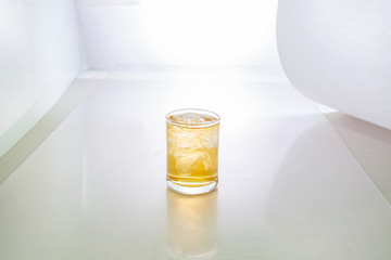 glass of  tincture on white background