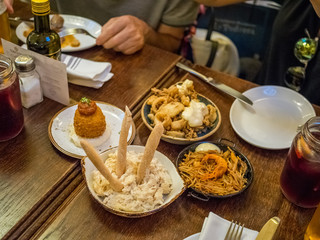 Spanish tapa called bomba served at a restaurant in Barcelona, Spain