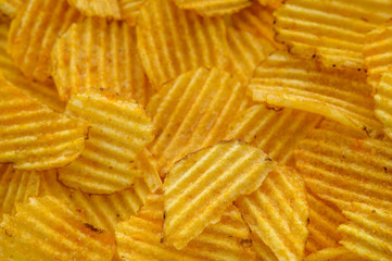 background of potato chips in the sunlight
