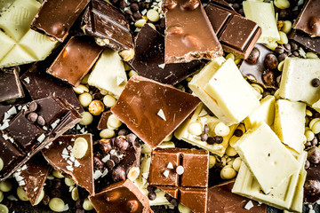 Broken pieces of dark, milk and white chocolate