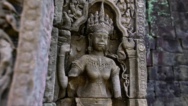 4K, Carved structures in Preah Khan. Ancient carvings adorn the temple walls of world-heritage site Angkor Thom. Bas reliefs and stone sculpture on the building of Khmer empire. Ruins of Cambodia.-Dan