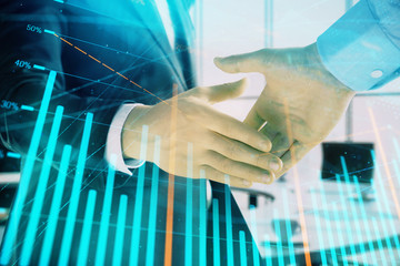 Multi exposure of financial graph on office background with two businessmen handshake. Concept of success in business