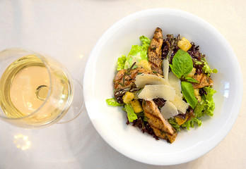 top view salad with meat cheese greens and crackers, a tasty and healthy snack, restaurant serving