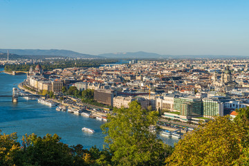 Fototapeta na wymiar Budapest, Hungary - October 01, 2019: Panoramic cityscape view of hungarian capital city and Danube river of Budapest from the Gellert Hill.