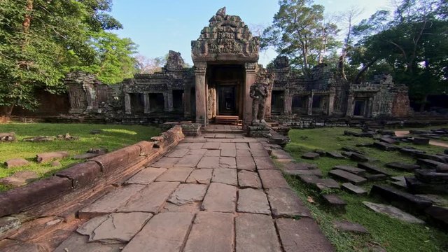 4K, Entrance door to Preah Khan temple. Gate with one guard sculpture. Ancient monument ruins in Angkor Thom Cambodia. Religious architecture landmarks buildings near Siem Reap. Khmer empire. -Dan