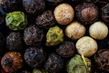 Peppercorn close-up. The concept of hot spices cooking, types of pepper. Macro photo.
