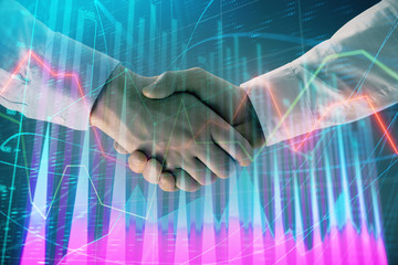 Multi exposure of forex graph on abstract background with two businessmen handshake. Concept of success on stock market