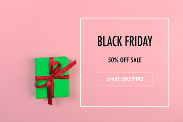 Gift box with ribbon and bow on color background and space for text. Black friday sale - Image
